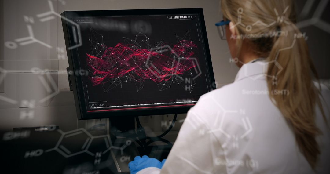 Female Scientist Analyzing Data on Computer Screen in Laboratory