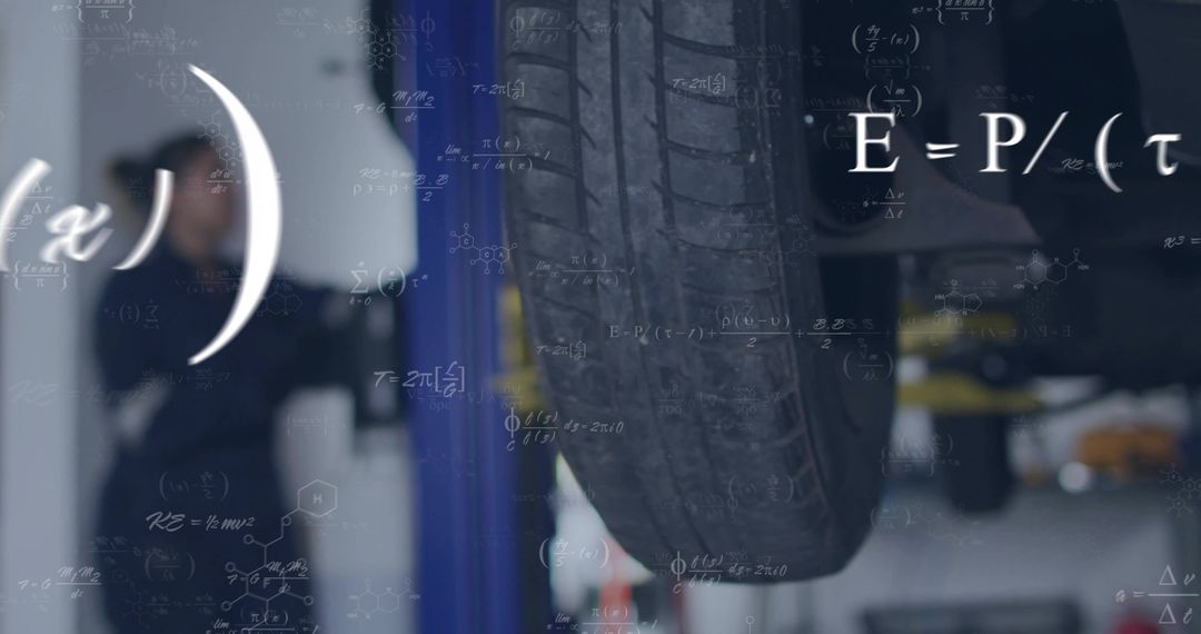 Close-Up of Car Tire on Hydraulic Lift in Auto Workshop