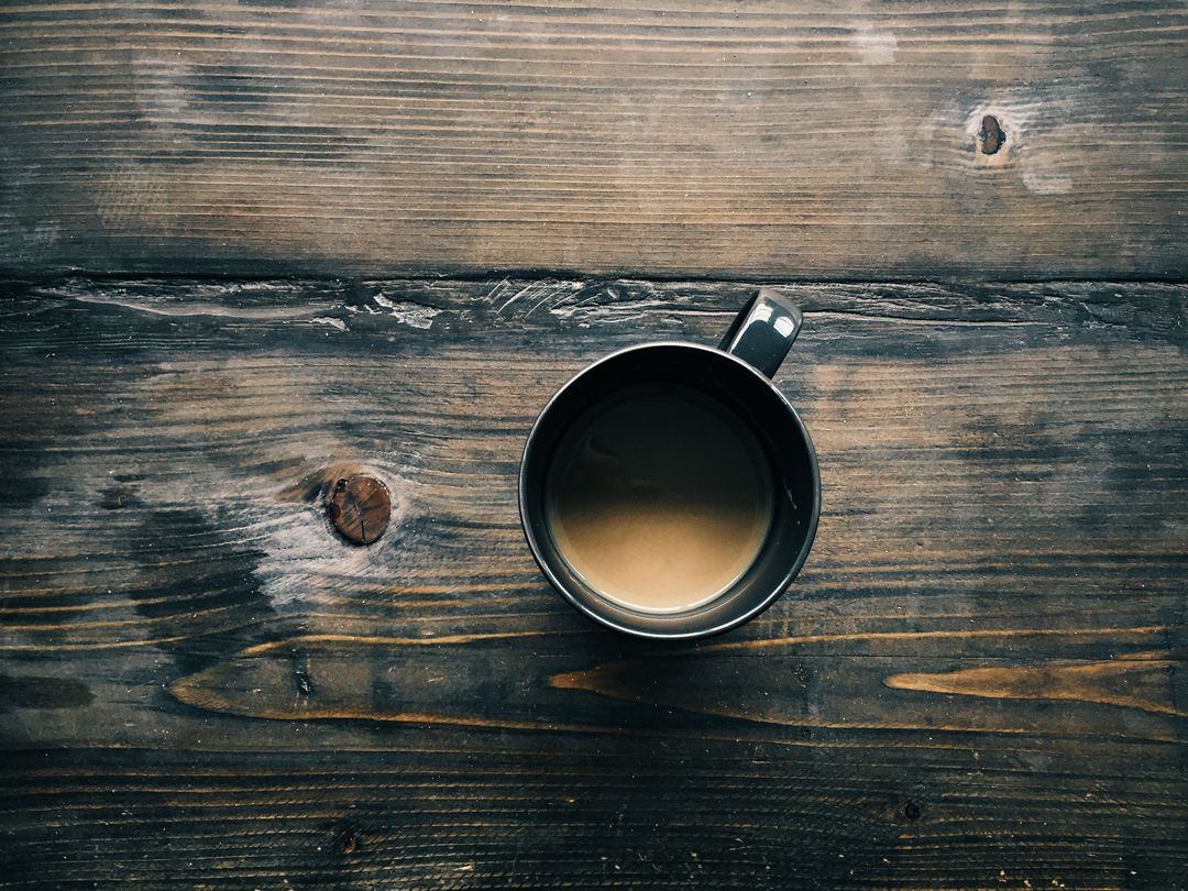 Black Coffee Mug on Rustic Wooden Table - Free Images, Stock Photos and Pictures on Pikwizard.com