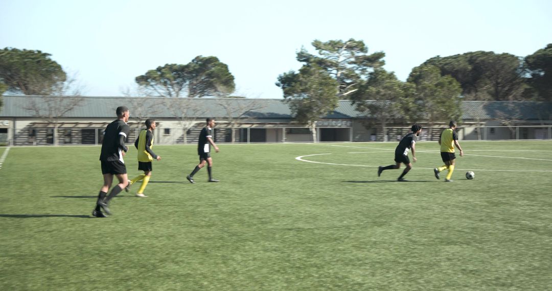 Soccer Players Practicing on Sunny Day in Team Jerseys