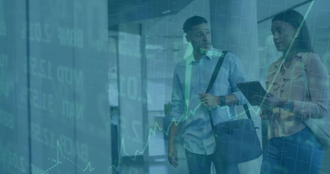 Colleagues Analyzing Financial Data Overlay in Vibrant Office Environment