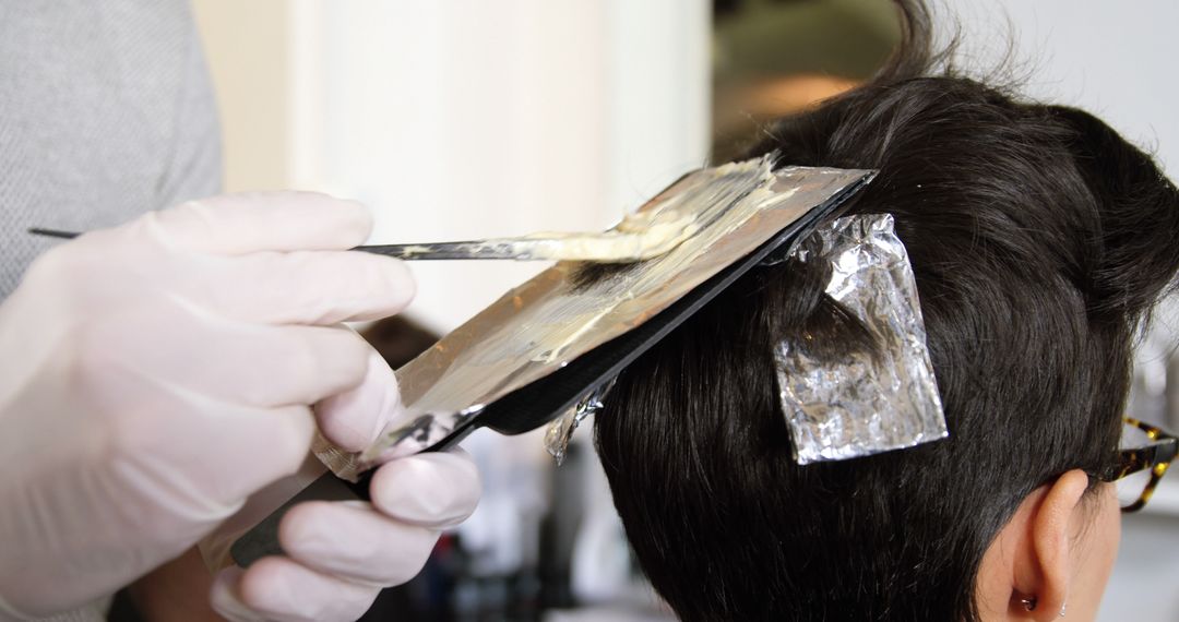 Hairdresser Applying Bleach on Client's Hair in Salon - Free Images, Stock Photos and Pictures on Pikwizard.com