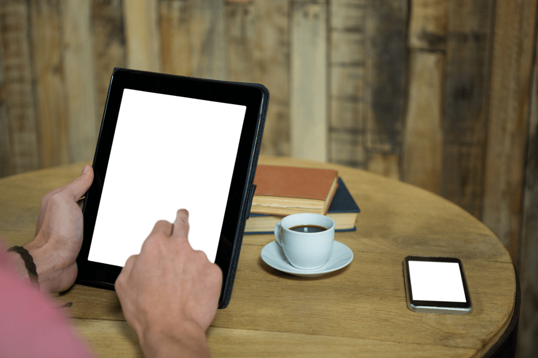 Transparent Tablet Screen with Coffee and Smartphone on Wooden Table