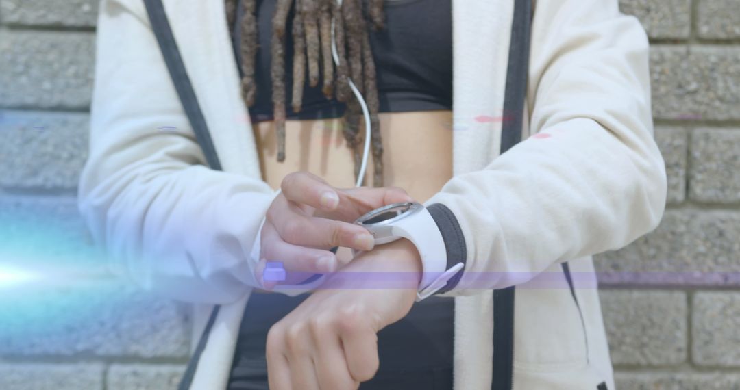 Woman Wearing Casual Hoodie Checking Smartwatch Outdoors