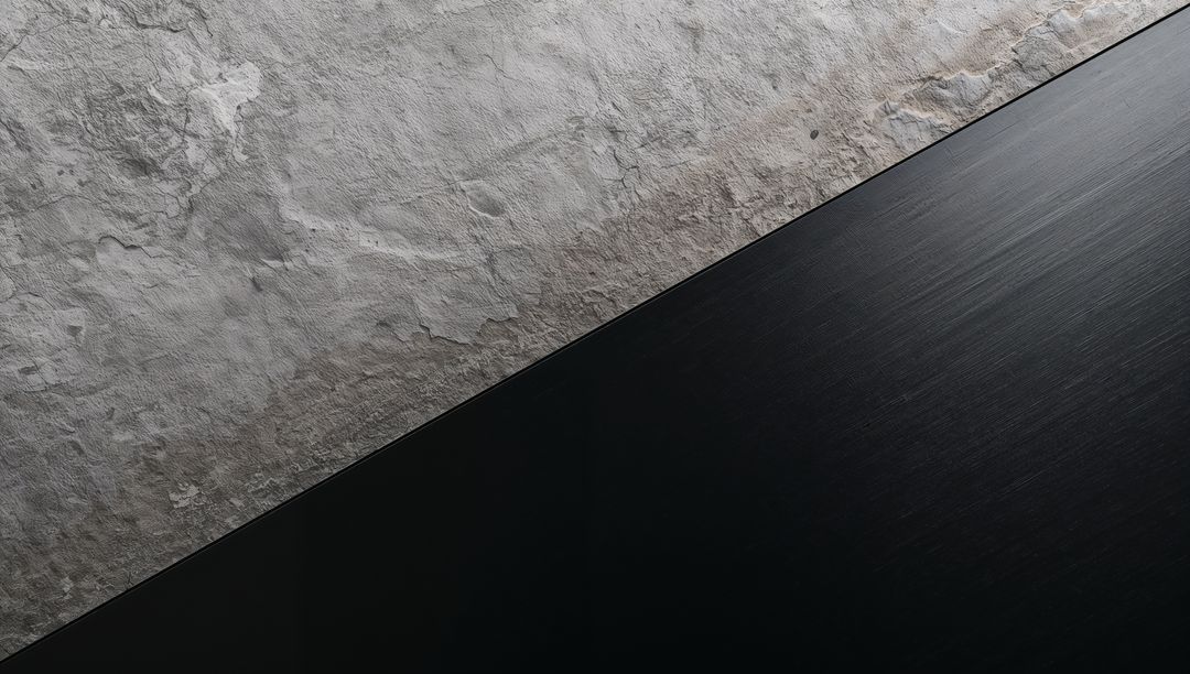 Diagonal Contrast Showing Weathered Plaster Meeting Dark Brushed Metal Panel