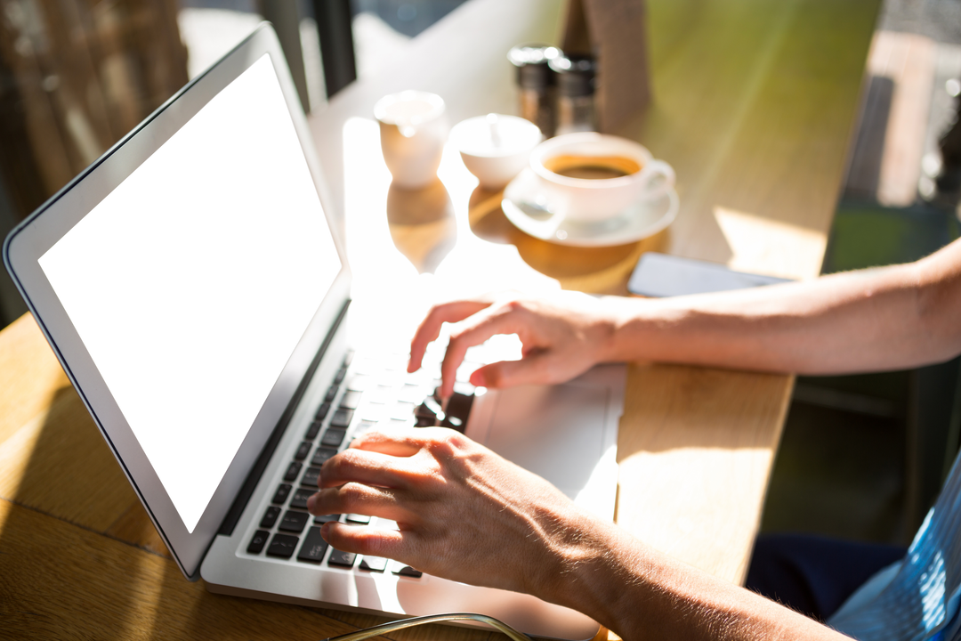 Transparent Display of Laptop Usage in Sunny Cafe Environment - Download Free Stock Images Pikwizard.com