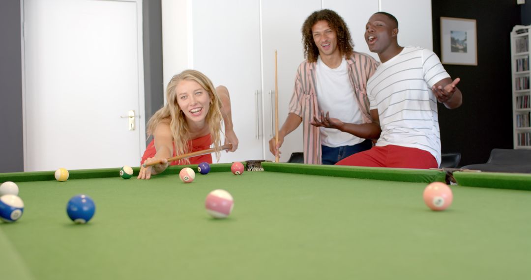 Friends Enjoy Casual Game Night with Pool Table Challenge