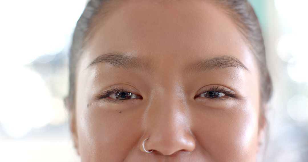 Close-up of Smiling Teenager with Nose Ring