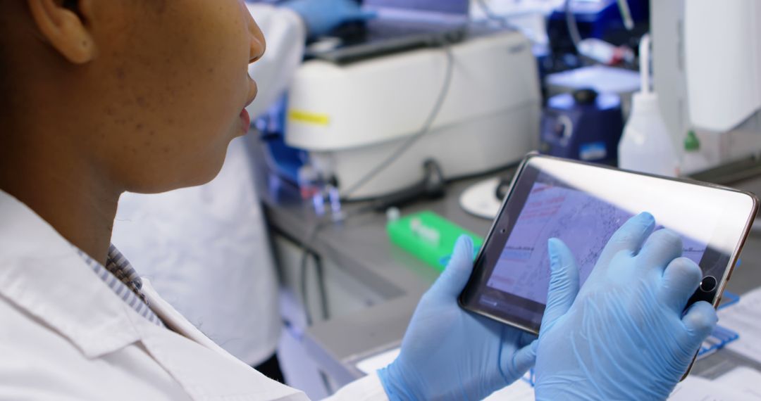 Scientist Using Tablet in Laboratory for Research - Free Images, Stock Photos and Pictures on Pikwizard.com