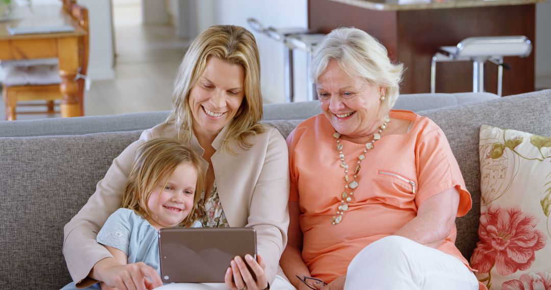 Three Generations of Women Enjoying Tablet Together at Home - Free Images, Stock Photos and Pictures on Pikwizard.com