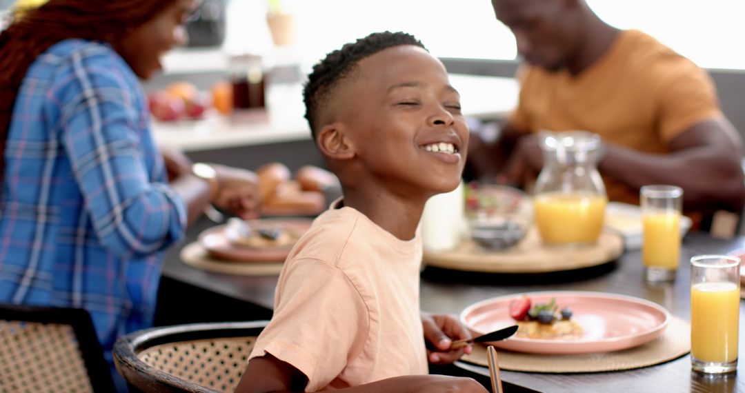 Joyful Family Enjoying Meal Time Together in Home Setting