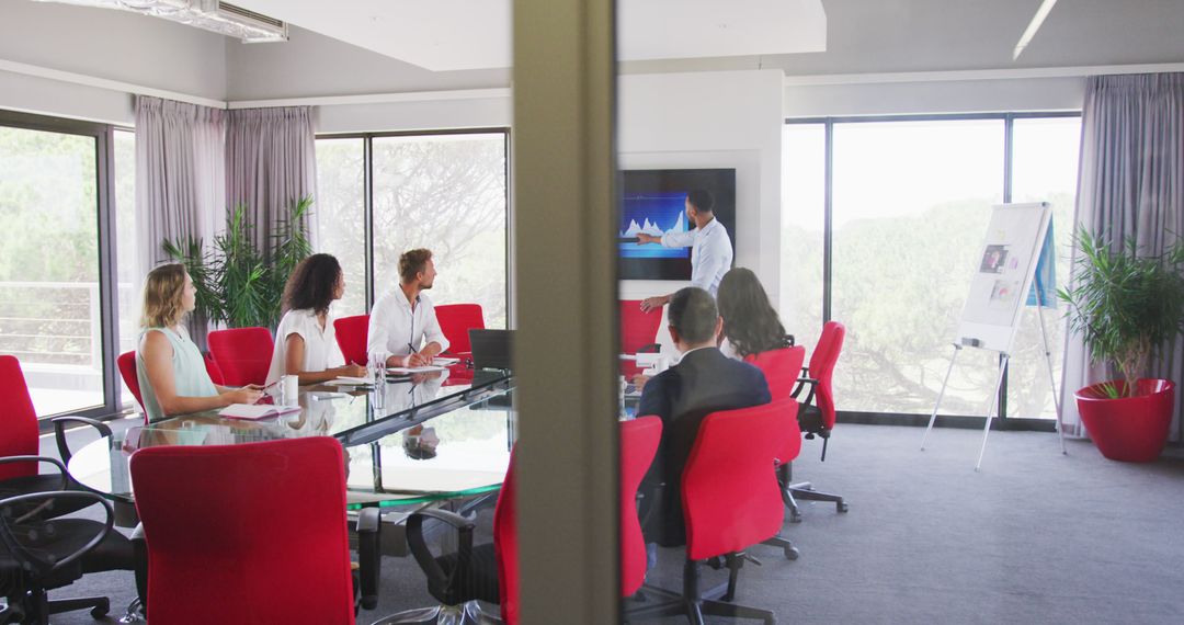 Business Presentation in Modern Office with Red Chairs - Free Images, Stock Photos and Pictures on Pikwizard.com