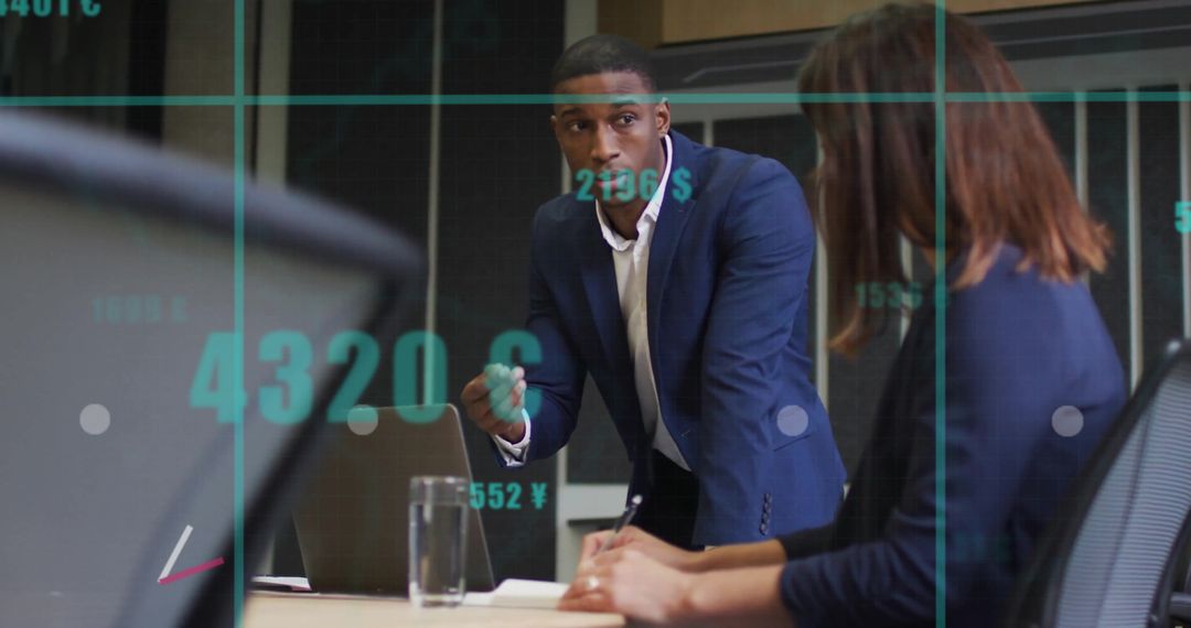 Business Colleagues Analyzing Digital Data on Office Screen