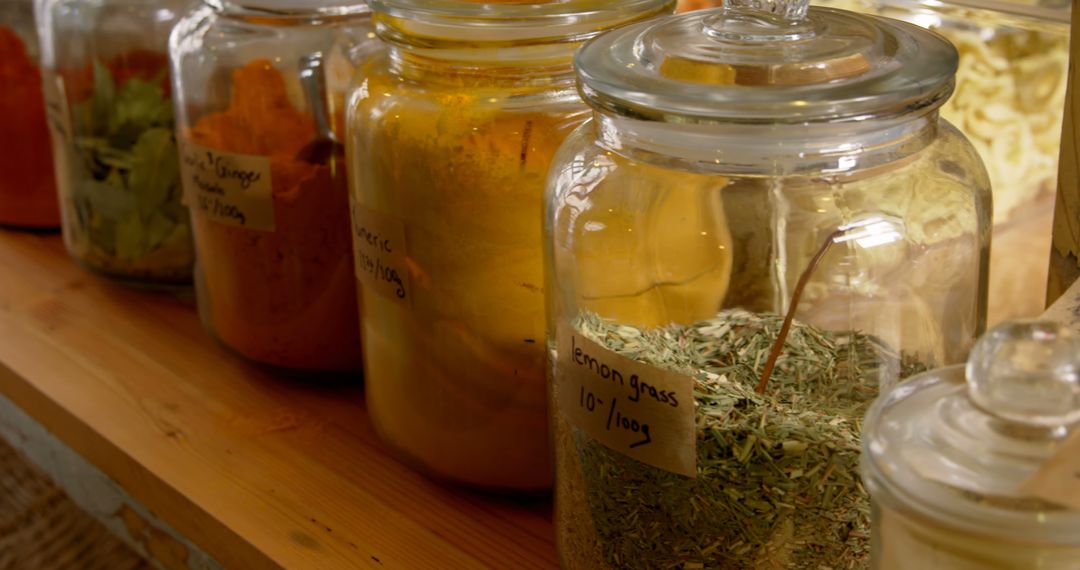 Close-Up of Various Spices in Glass Jars on Wooden Shelf - Free Images, Stock Photos and Pictures on Pikwizard.com