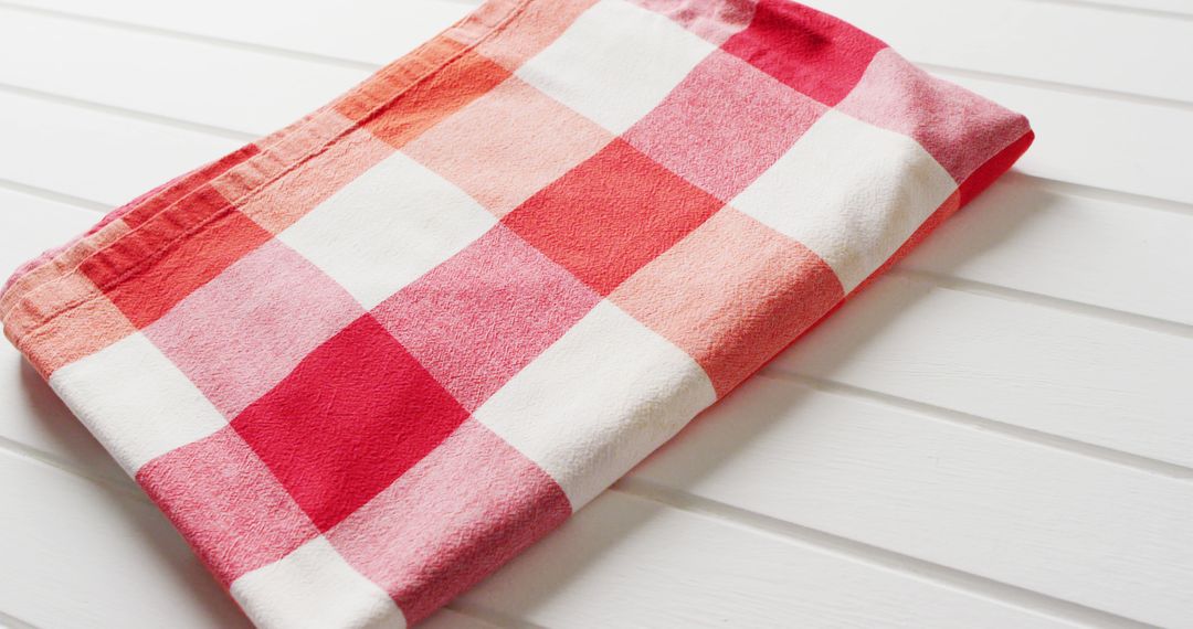 Close up of folded red and white checkered blanket on white background with copy space - Free Images, Stock Photos and Pictures on Pikwizard.com