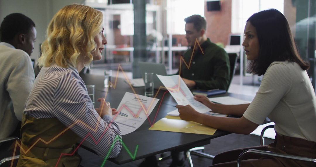 Collaborative Team Analyzing Financial Data in Modern Office Setting