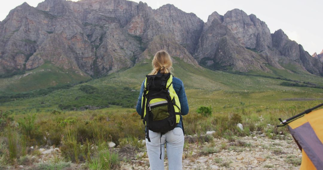 Woman Hiking with Backpack in Scenic Mountain Landscape - Free Images, Stock Photos and Pictures on Pikwizard.com