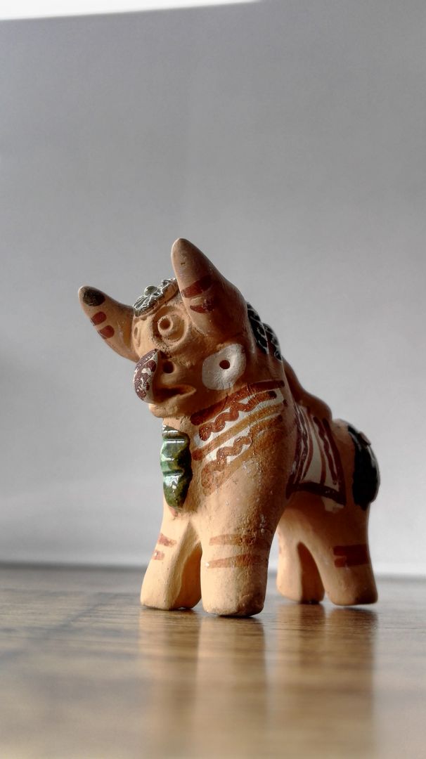 Handcrafted Clay Figurine with Tribal Design - Free Images, Stock Photos and Pictures on Pikwizard.com