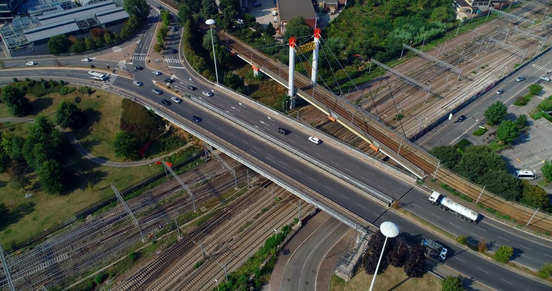 Aerial View of Busy Highway Overpass with Train Tracks Below - Free Images, Stock Photos and Pictures on Pikwizard.com