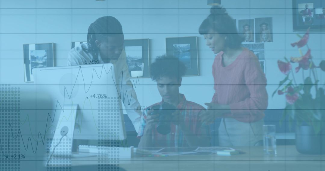 Diverse Team Analyzing Data on Tablet Offline in Modern Office