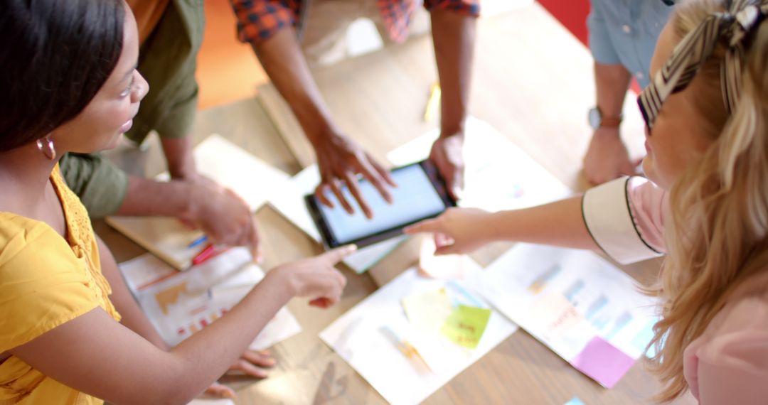 Diverse Team Collaborating on Creative Project in Office
