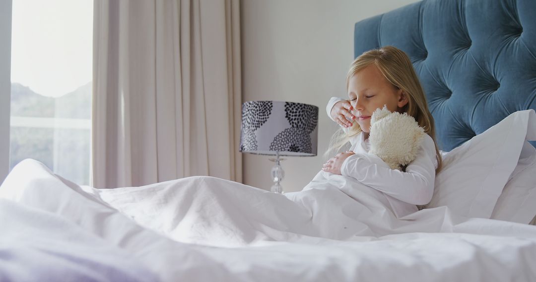 Sick Child in Bed with a Teddy Bear Sneezing - Free Images, Stock Photos and Pictures on Pikwizard.com