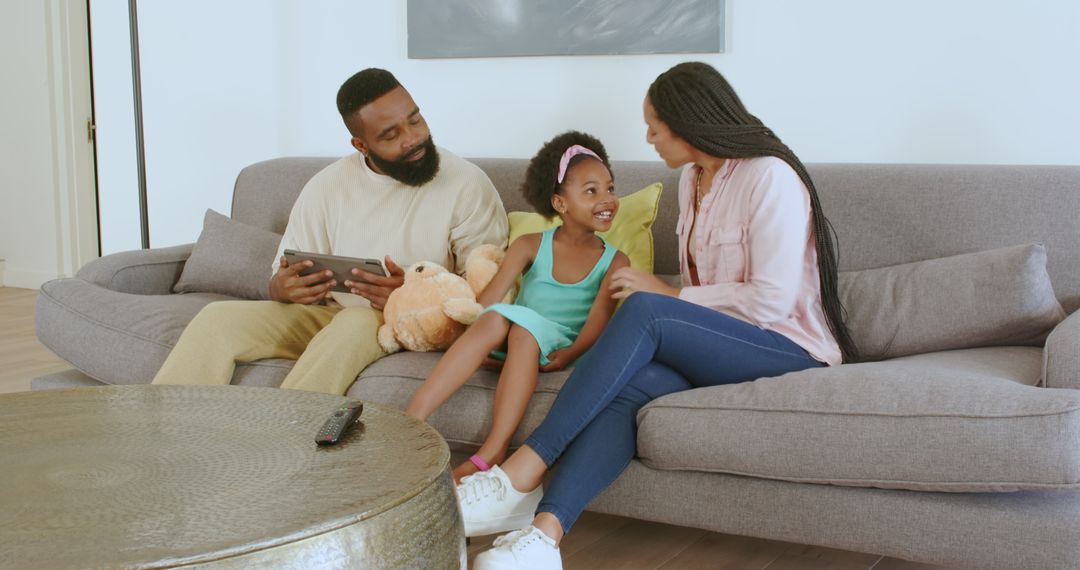Happy Family Bonding at Home with Tablet and Teddy Bear