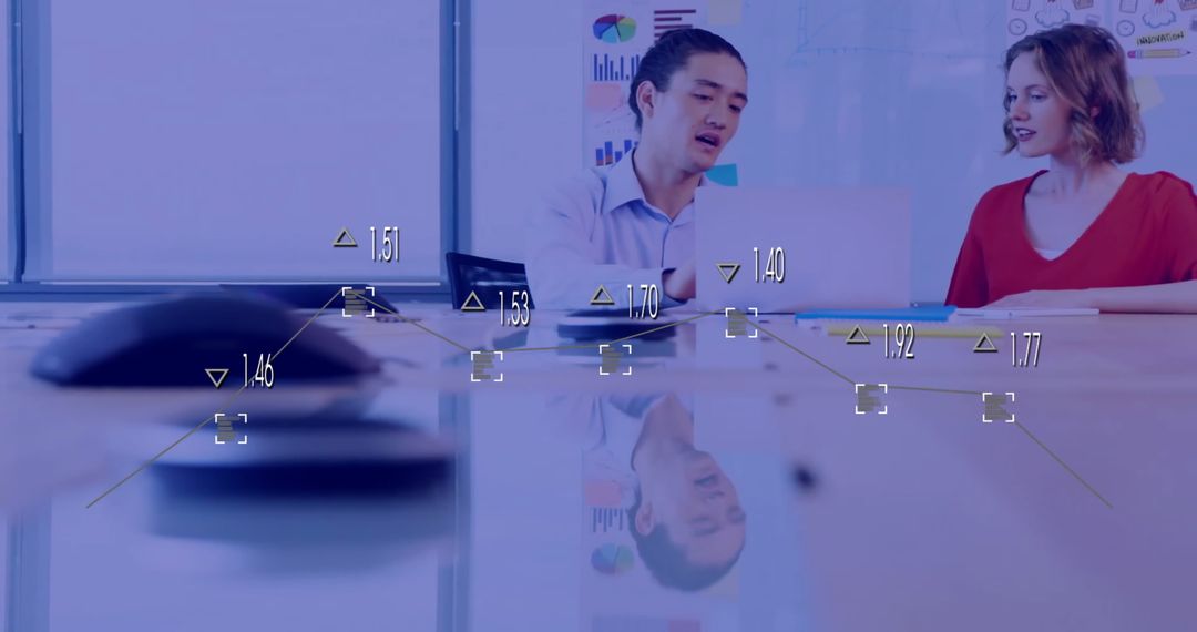 Diverse Team Engaging in Financial Data Discussion