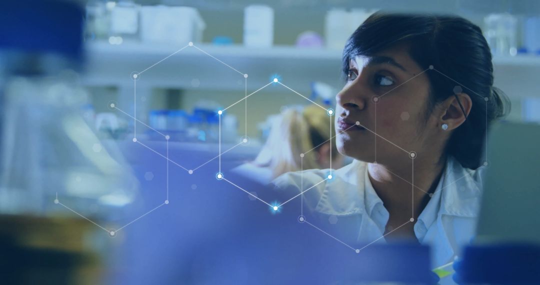 Innovative Biracial Female Scientist Analyzing Data in Laboratory