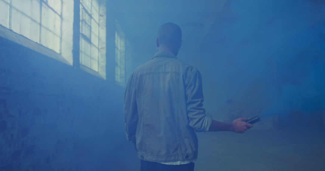 Mysterious Figure in Foggy Industrial Setting