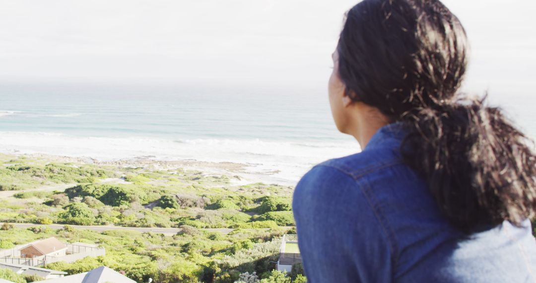 Woman Enjoying a Scenic View of the Ocean - Free Images, Stock Photos and Pictures on Pikwizard.com