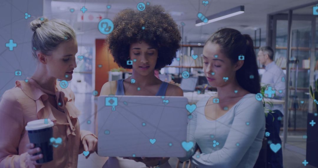 Diverse Team Collaborating with Laptop and Digital Media Icons in Office