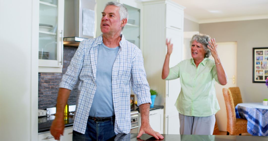 Senior Couple Having Argument in Modern Kitchen - Free Images, Stock Photos and Pictures on Pikwizard.com