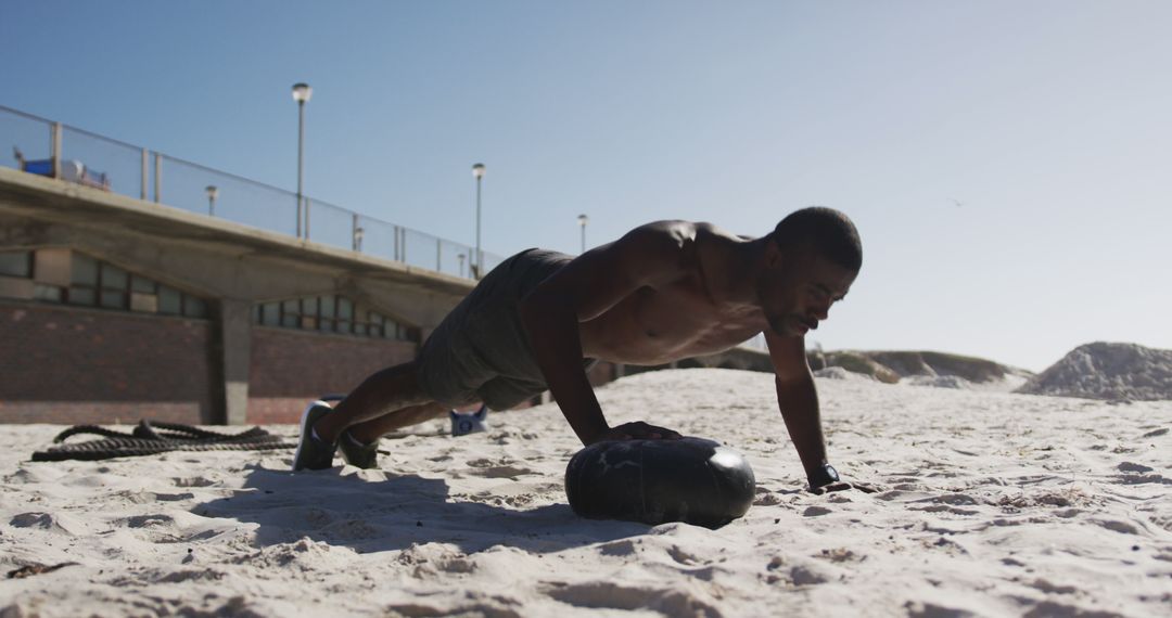 Man Performing Outdoor Push-Ups on Sandy Beach - Free Images, Stock Photos and Pictures on Pikwizard.com