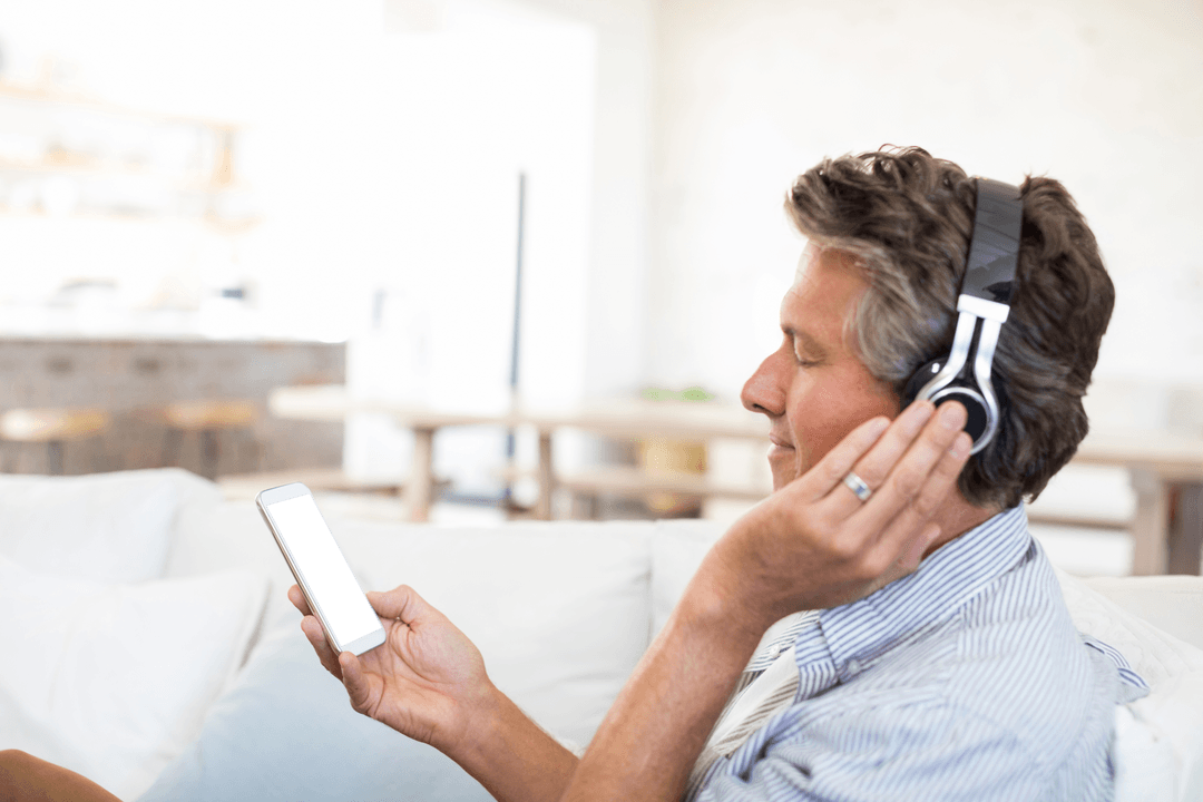 Transparent Peaceful Man Listening to Music with Headphones at Home