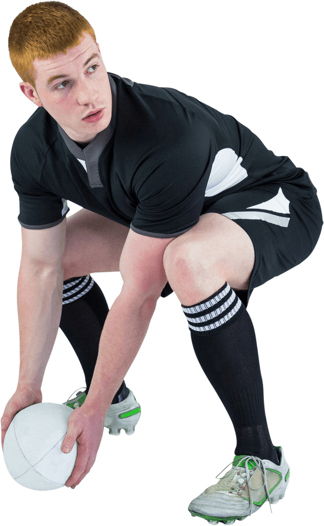 Young Rugby Player in Black Uniform Bending Transparently with Rugby Ball