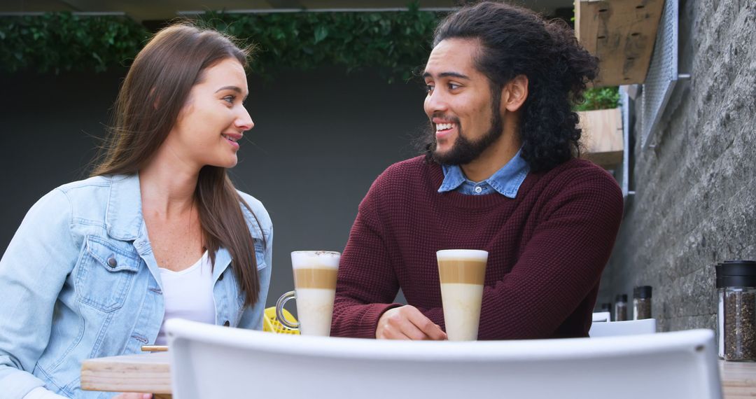 Young Couple Enjoying Outdoor Coffee Date with Copy Space