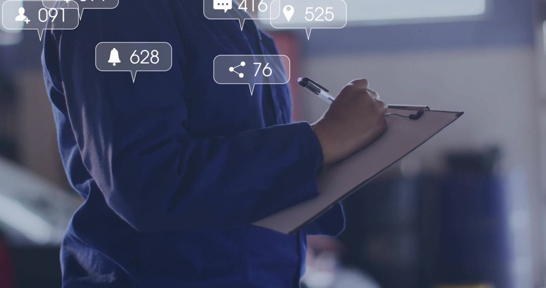 Technician Holding Clipboard and Writing in Workshop with Notifications