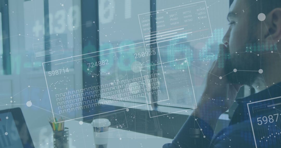 Businessman Analyzing Digitized Financial Data in Modern Office