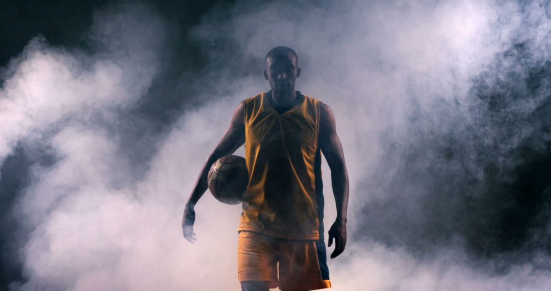 Basketball Player in Yellow Uniform Walking Through Fog - Free Images, Stock Photos and Pictures on Pikwizard.com