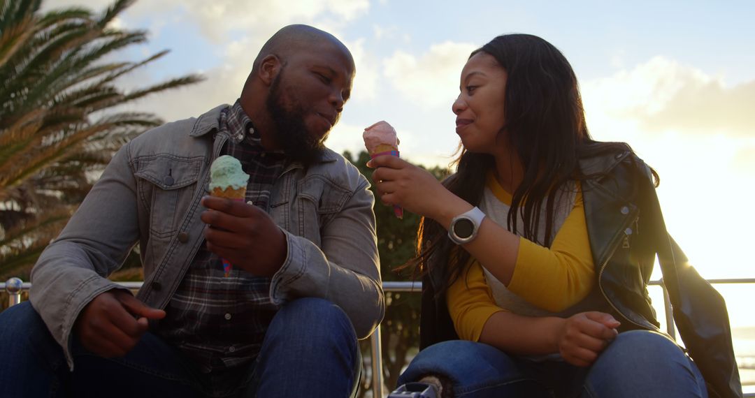 Smiling Couple Eating Ice Cream Together on Sunny Day - Free Images, Stock Photos and Pictures on Pikwizard.com