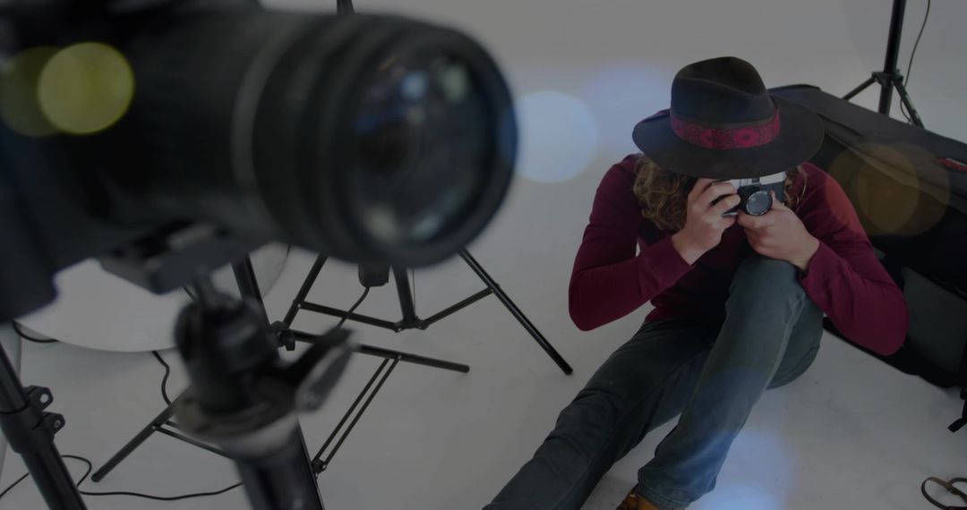 Creative Photgrapher Preparing Shoot with Camera in Studio Environment