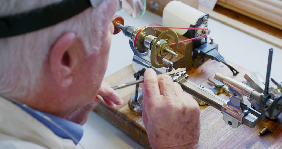 Senior Man Operating Precision Watchmaker Lathe Machine at Workshop - Free Images, Stock Photos and Pictures on Pikwizard.com