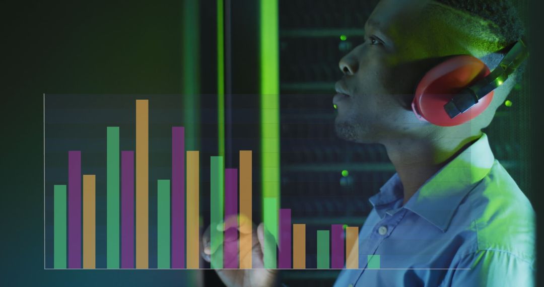 Data Analyst Reviewing Graphs in Server Room