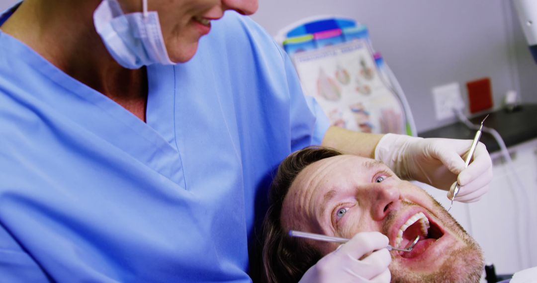 Close-up of Dentist Treating Male Patient's Teeth - Free Images, Stock Photos and Pictures on Pikwizard.com