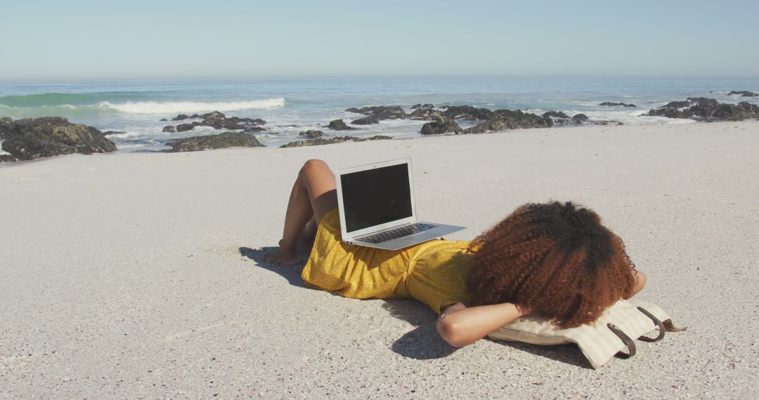 Woman Relaxing on Beach with Laptop Working Remotely - Free Images, Stock Photos and Pictures on Pikwizard.com