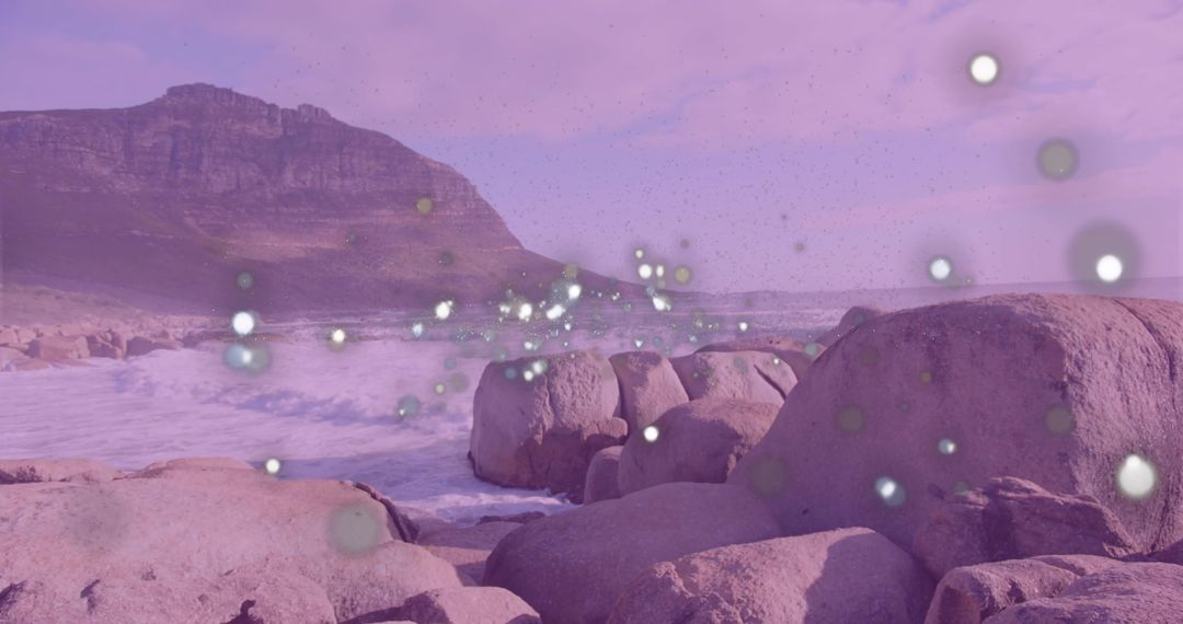 Ethereal Shoreline with Luminous Orbs and Rugged Mountain