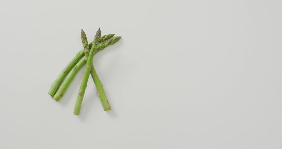 Fresh Asparagus Spears Over White Background - Free Images, Stock Photos and Pictures on Pikwizard.com