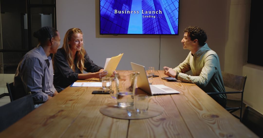 Group of Professionals Collaborating in Evening Business Meeting