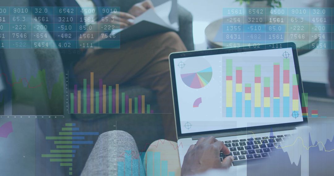 Professionals Analyzing Data with Laptop in Modern Lounge Environmen